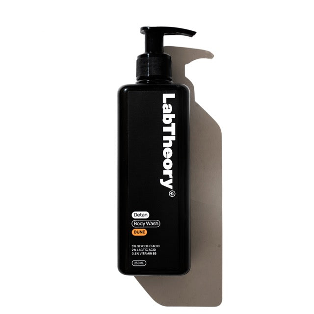 Black bottle of LabTheory Dune body wash on a white background