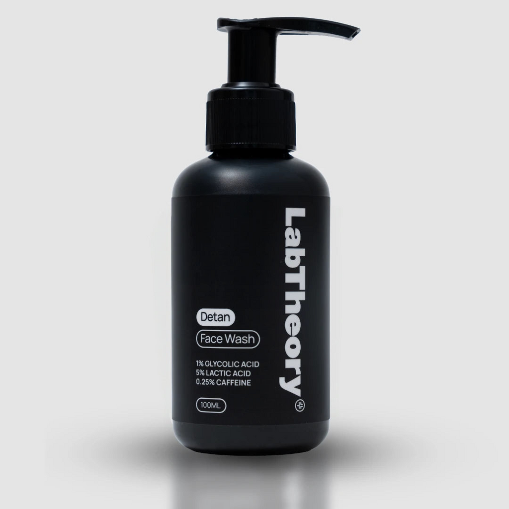 Black bottle of LabTheory Detan Face Wash on a white background