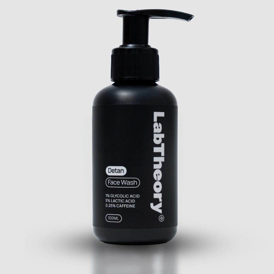Black bottle of LabTheory Detan Face Wash on a white background